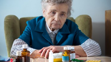 Senior-Elderly-Woman-Drugs-Prescription-Pills-Sad